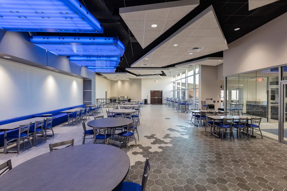 Autry Tech café dining room with blue LED cove lighting and hexagon tile flooring