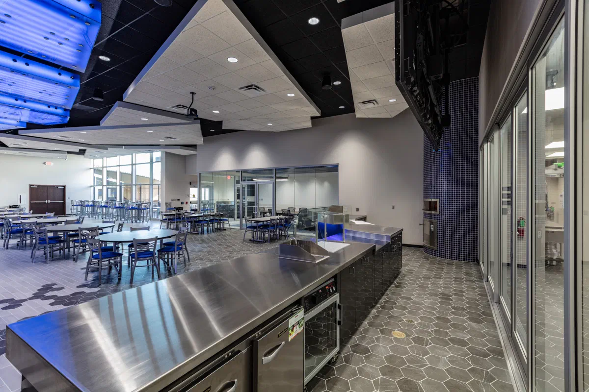 Stainless serving line and dining area inside the Autry culinary center
