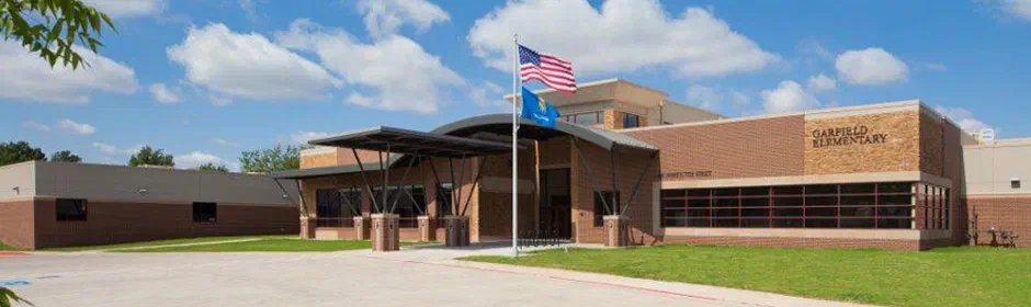 Garfield Elementary School exterior with flagpole and brick facade