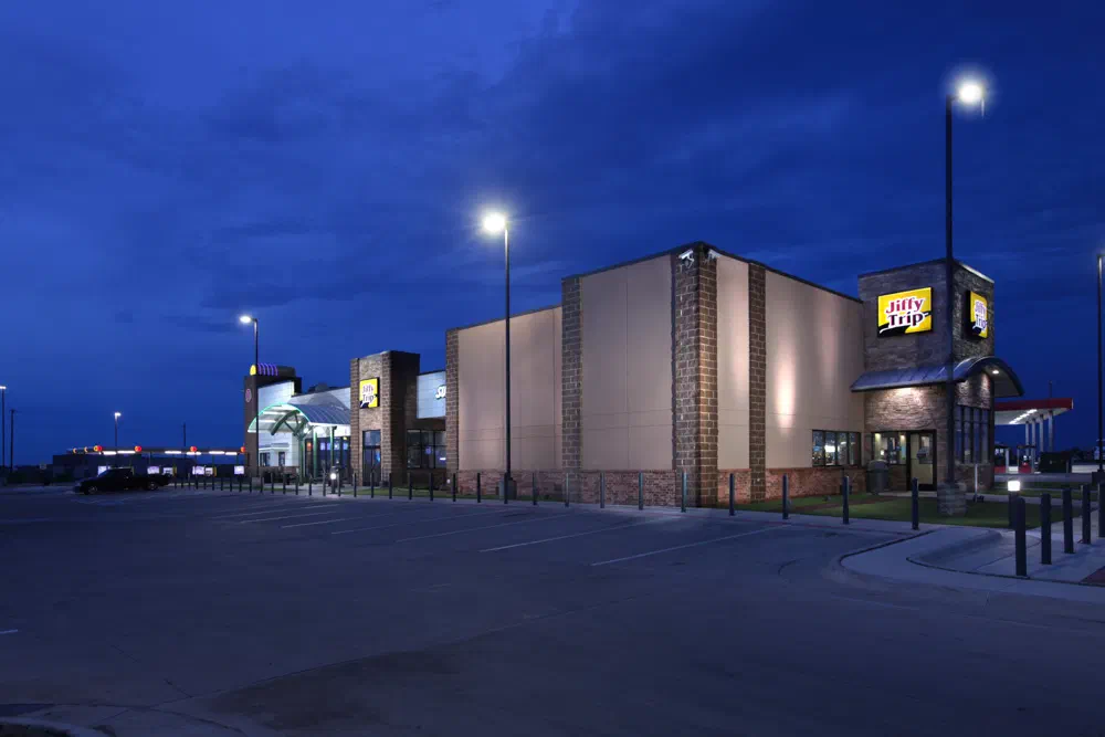 JiffyTrip convenience store exterior with tower element at dusk
