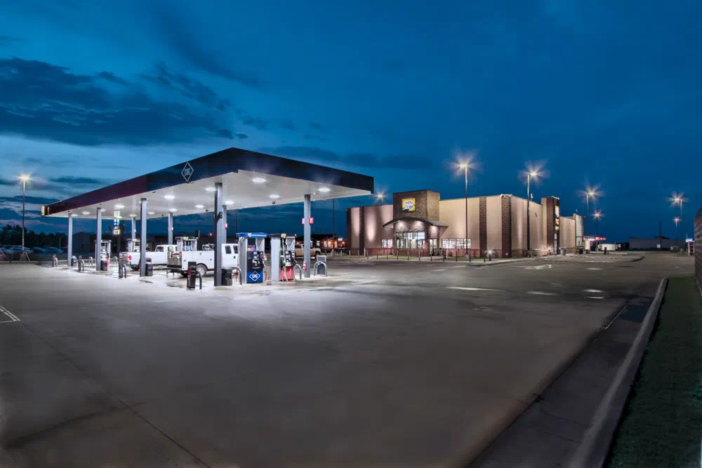 JiffyTrip fuel canopy with LED lighting and multiple fuel islands at night