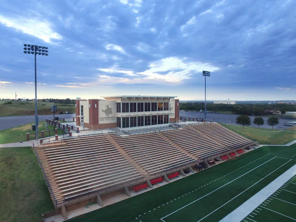 NWOSU baseball field house and covered grandstand at sunset